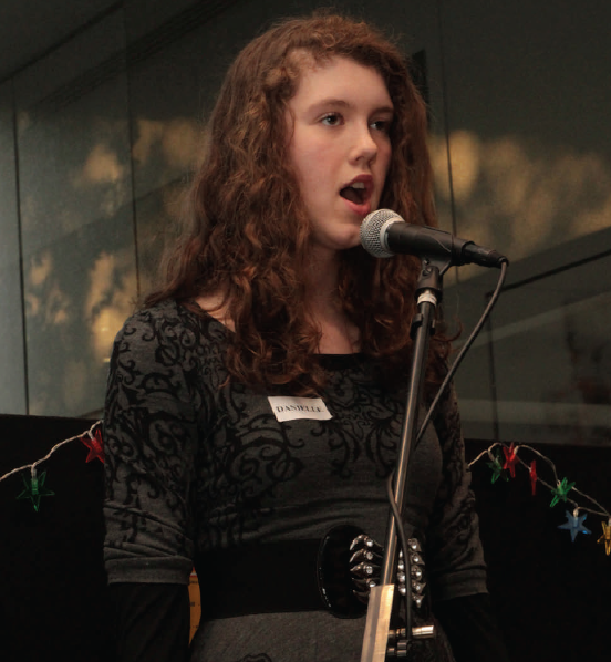 Danielle singing on stage